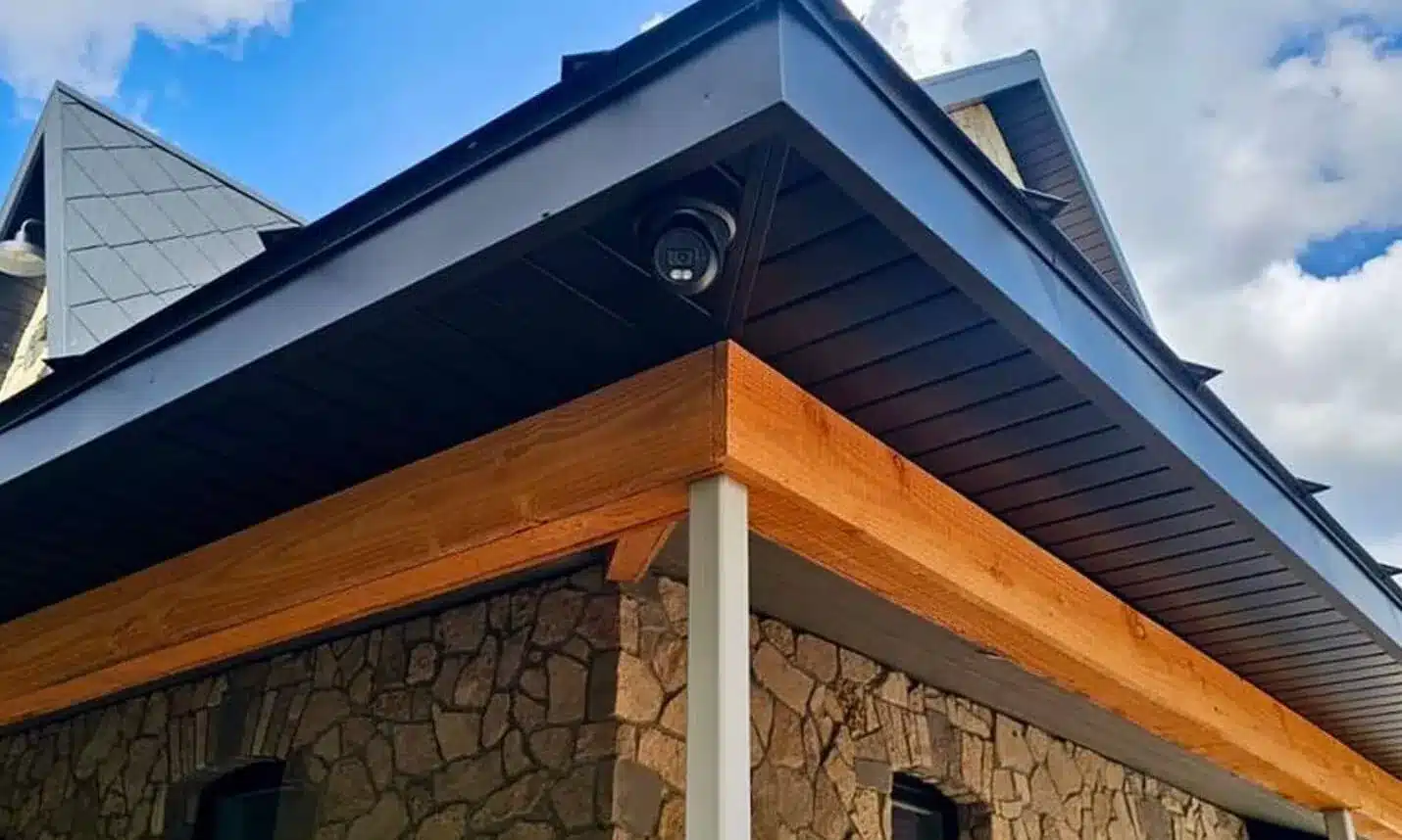 Uniview dome camera under the eave of a home, installed by JR Security Solutions in Wellington County, Ontario